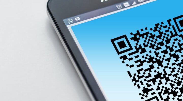 Close up of a smart packaging label with scannable QR code glowing under NFC activation showing AR overlay on a smartphone screen displaying product info and recycling instructions futuristic tech vibe