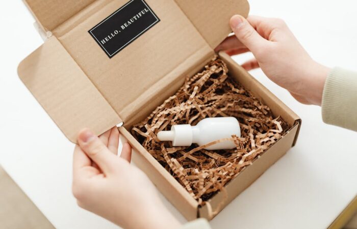 Vibrant unboxing scene with a custom printed rigid box opening to reveal premium products colorful tissue paper and branded inserts evoking excitement and luxury