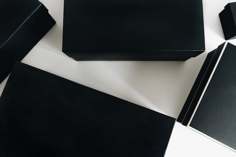 Step by step visual of custom packaging production process from design software to finished branded boxes on an assembly line highlighting printing and die cutting